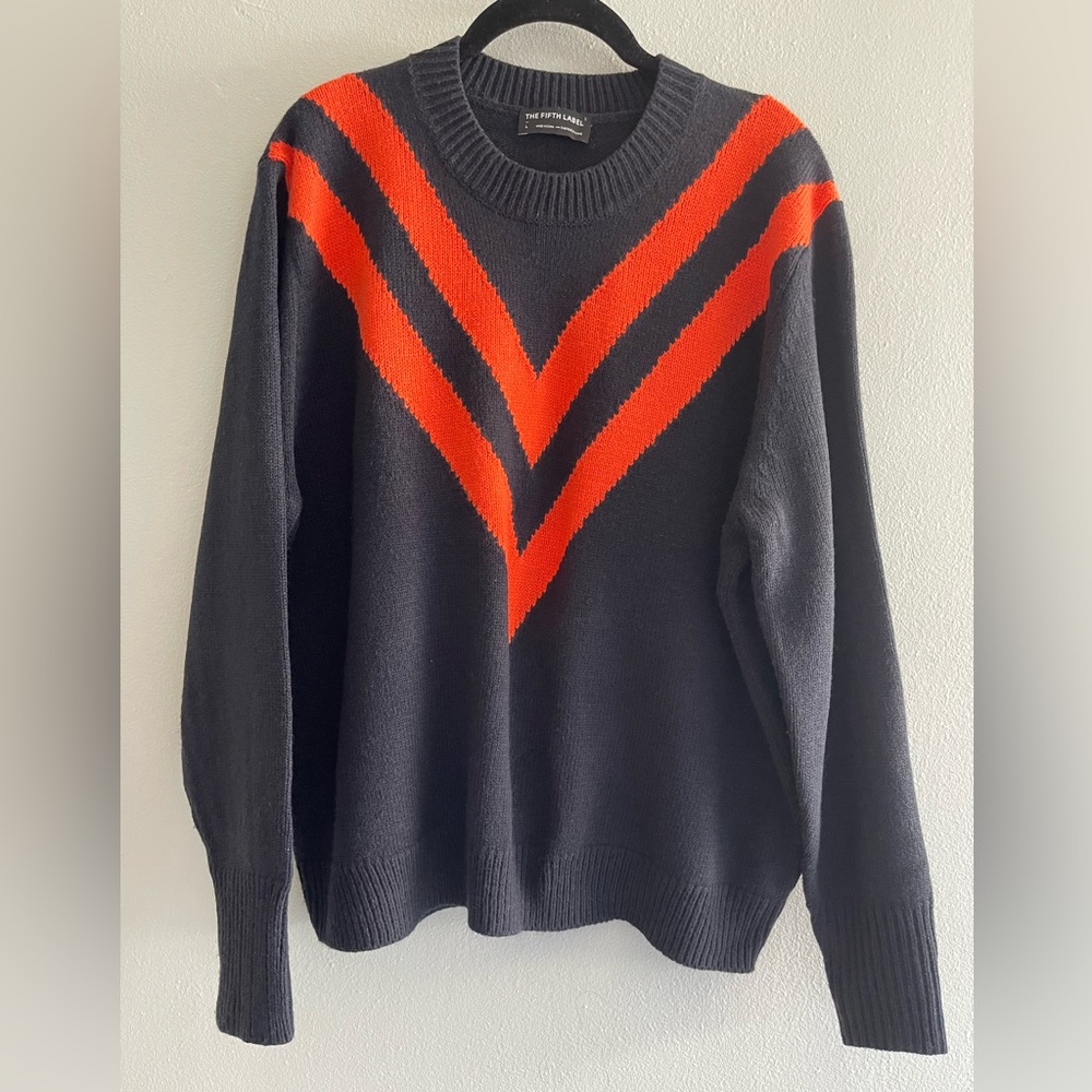 The Fifth Label Navy Sweater with Orange  Accent Stripes from Anthropologie.